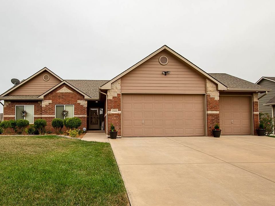 A Casa Bella brick home with manicured lawn